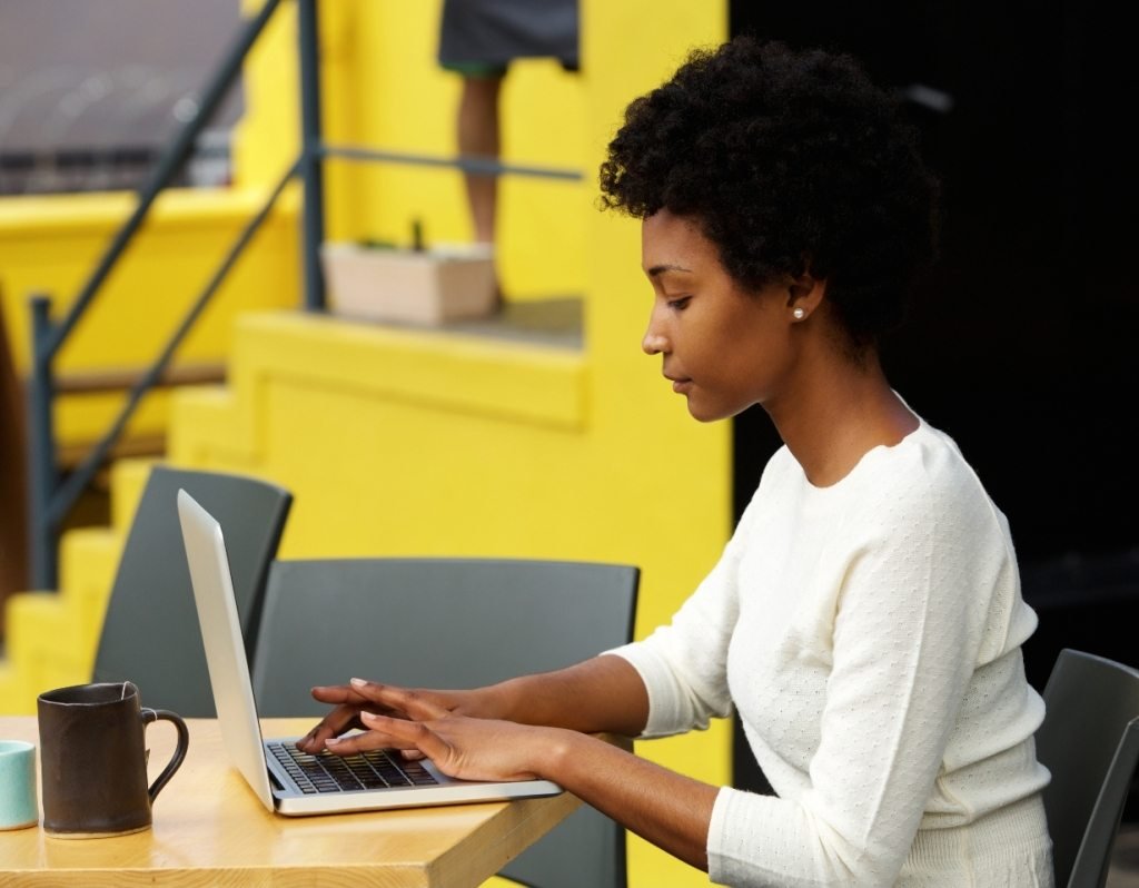 attractive young woman using laptop outside P9RLFGU@2x 1024x798 1